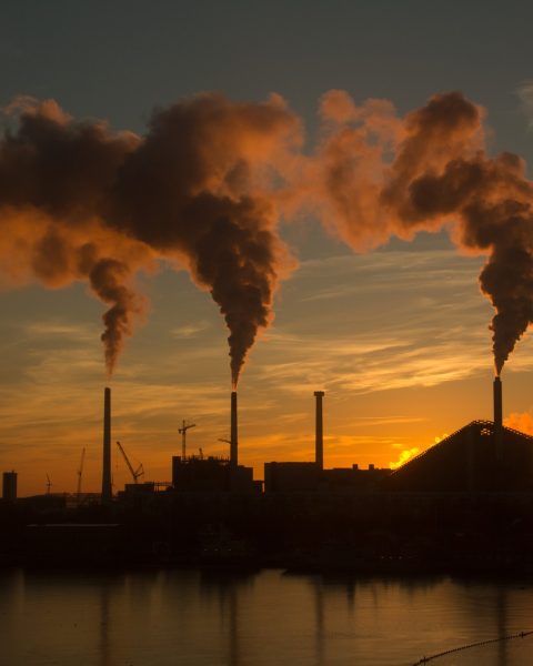 [fpdl.in]_low-angle-shot-factory-with-smoke-steam-coming-out-chimneys-captured-sunset_181624-44694_full